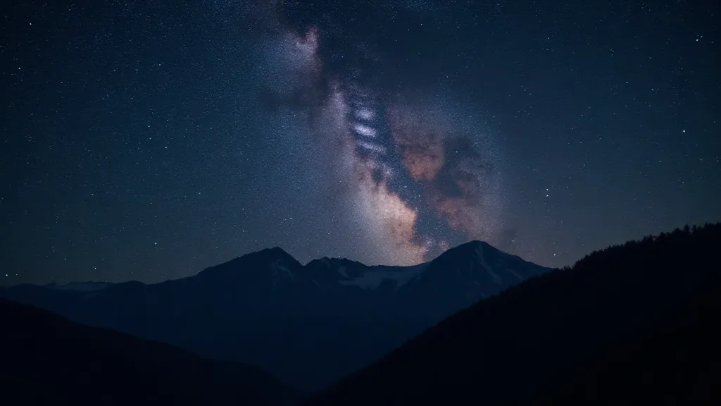 Starry night sky over mountains